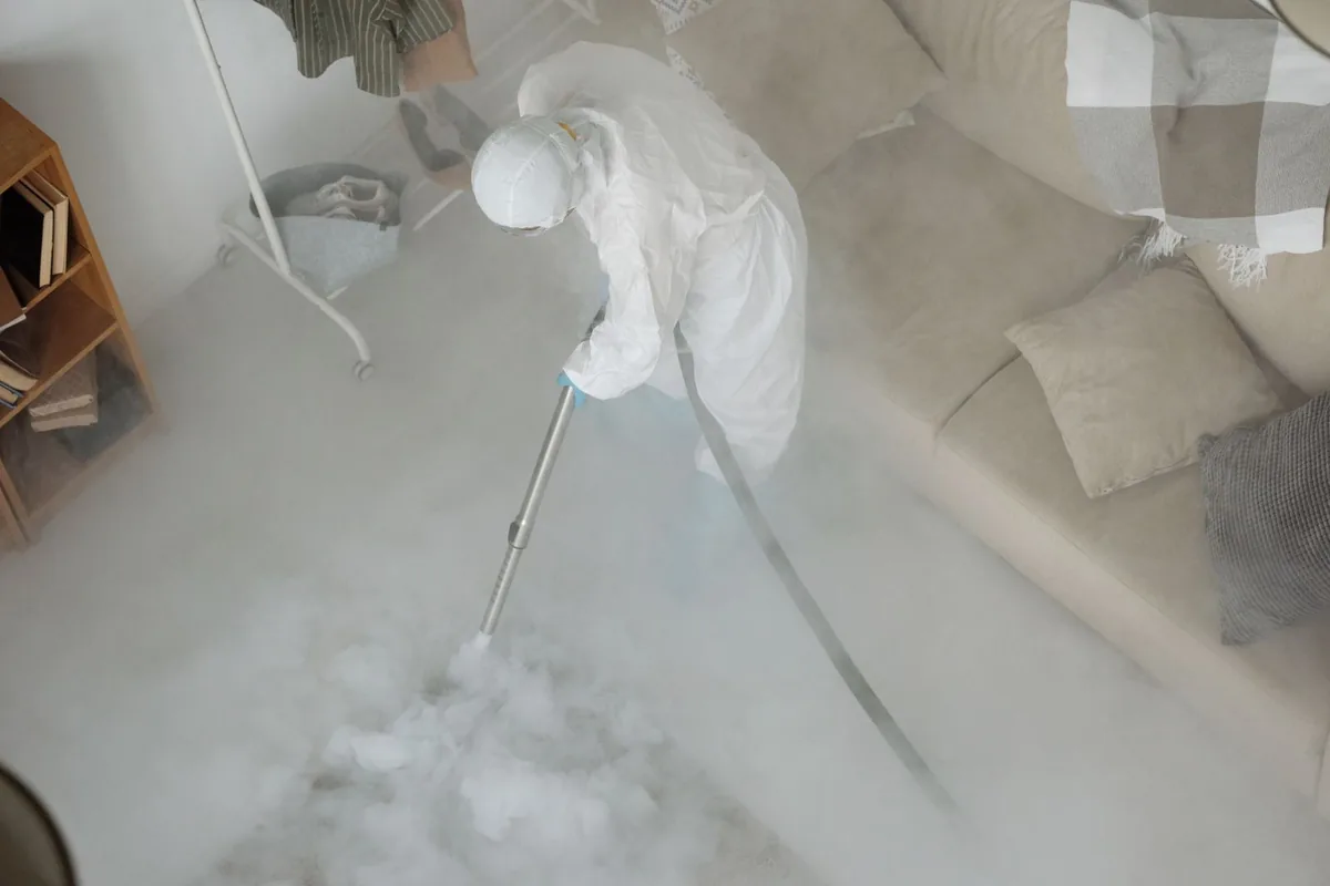 Biohazard cleanup technician in protective equipment, Boggy Creek, Orlando, FL